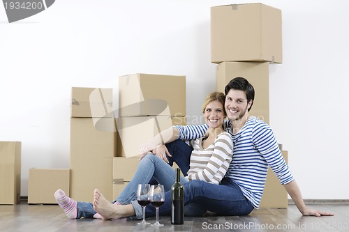 Image of Young couple moving in new home