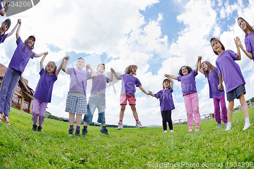 Image of happy kids group  have fun in nature