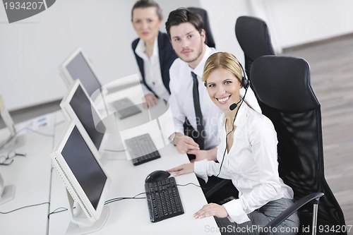 Image of business people group working in customer and help desk office