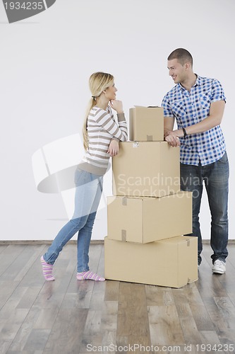 Image of Young couple moving in new home