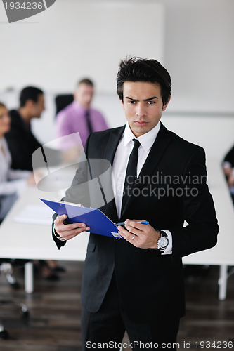 Image of young business man at meeting