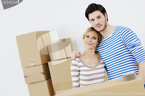 Image of Young couple moving in new house