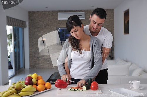 Image of young couple have fun in modern kitchen