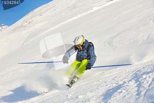 Image of skiing on fresh snow at winter season at beautiful sunny day