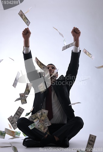 Image of Business man holding money