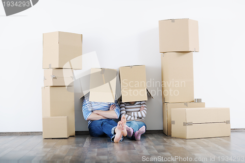 Image of Young couple moving in new house