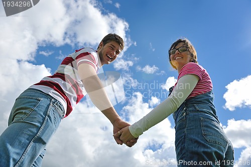 Image of romantic young couple in love together outdoor