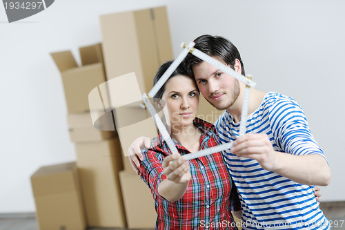 Image of Young couple moving in new house