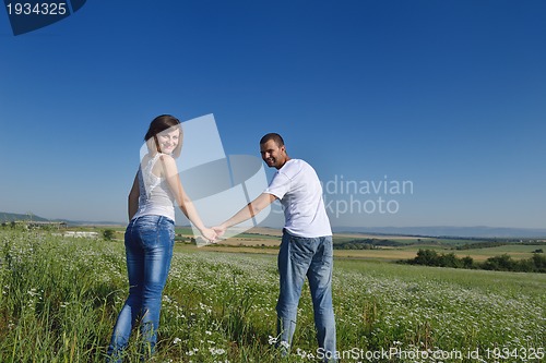 Image of happy couple in wheat field