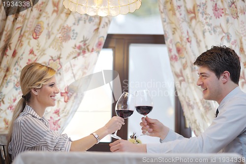 Image of young couple having dinner at a restaurant