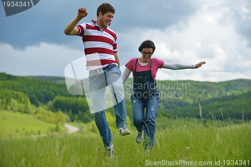 Image of romantic young couple in love together outdoor