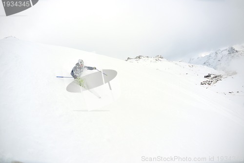 Image of skiing on fresh snow at winter season at beautiful sunny day