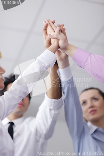 Image of business people group joining hands