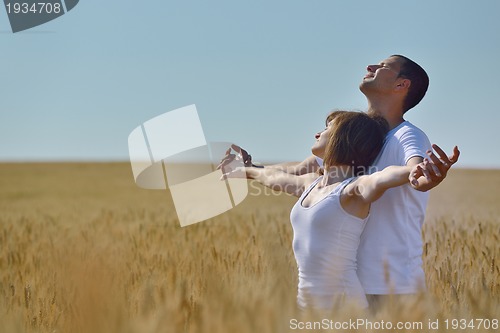 Image of happy couple in wheat field