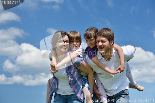 Image of happy young family have fun outdoors