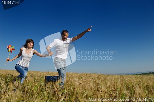 Image of happy couple in wheat field
