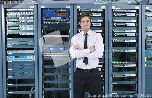 Image of young it engeneer in datacenter server room