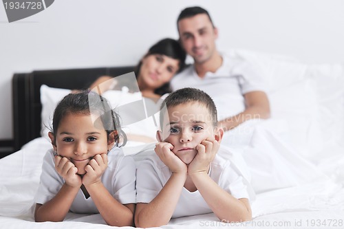 Image of happy young Family in their bedroom