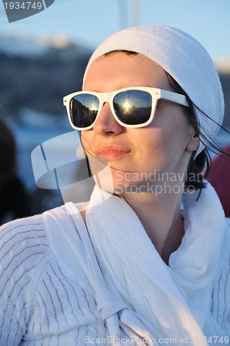 Image of Greek woman on the streets of Oia, Santorini, Greece