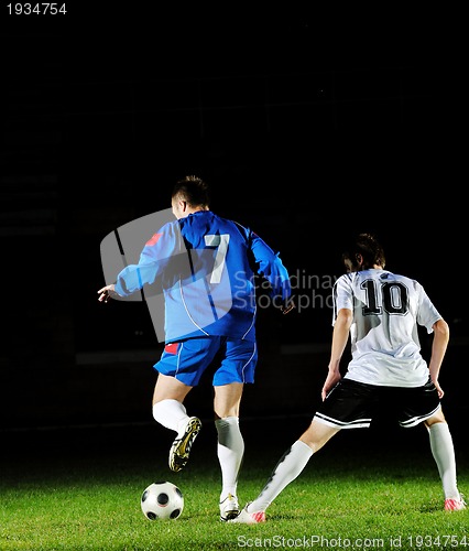 Image of football players in action for the ball