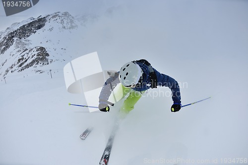 Image of skiing on fresh snow at winter season at beautiful sunny day