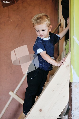 Image of beautiful young child making first steps