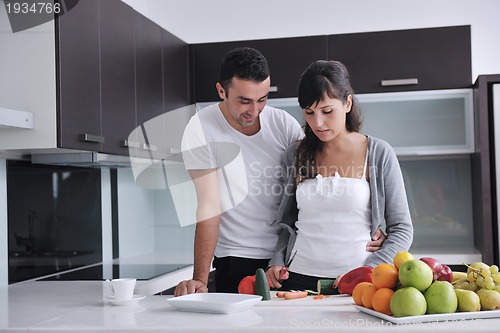 Image of young couple have fun in modern kitchen