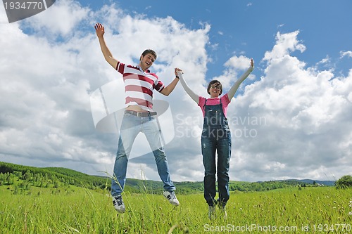 Image of romantic young couple in love together outdoor