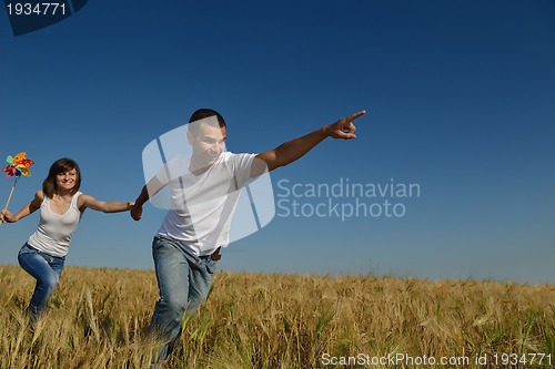 Image of happy couple in wheat field