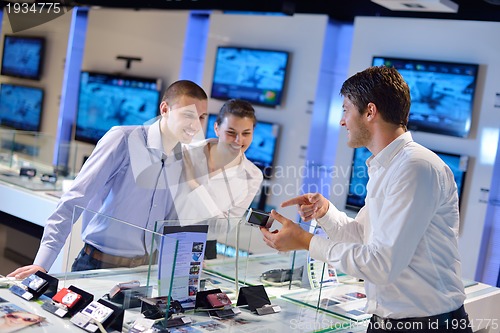 Image of people buy  in consumer electronics store