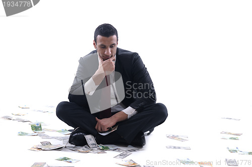 Image of Business man holding money