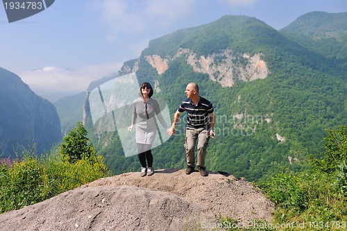 Image of happy young couple jumping in the air