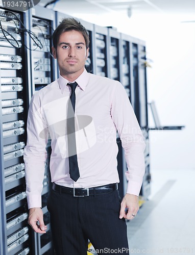 Image of young it engeneer in datacenter server room