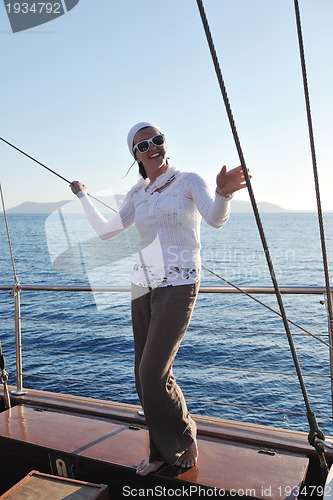 Image of Greek woman on the streets of Oia, Santorini, Greece