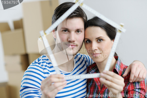 Image of Young couple moving in new house