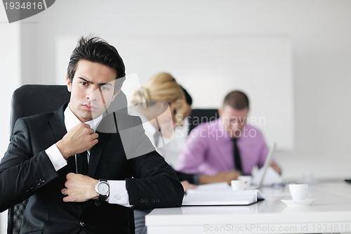 Image of young business man at meeting