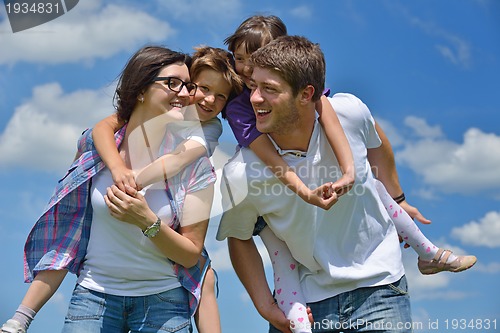 Image of happy young family have fun outdoors