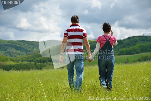 Image of romantic young couple in love together outdoor