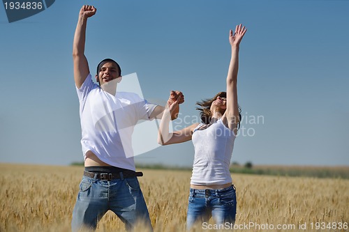 Image of happy couple in wheat field