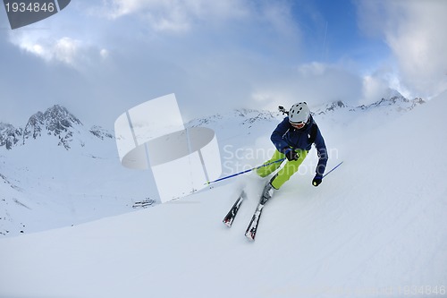 Image of skiing on fresh snow at winter season at beautiful sunny day