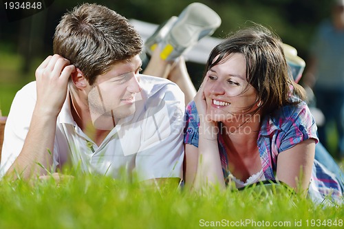 Image of happy young couple having a picnic outdoor