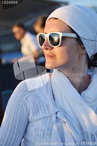 Image of Greek woman on the streets of Oia, Santorini, Greece