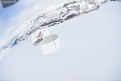 Image of skiing on fresh snow at winter season at beautiful sunny day