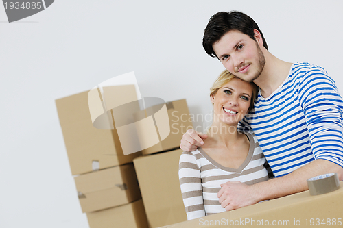 Image of Young couple moving in new house