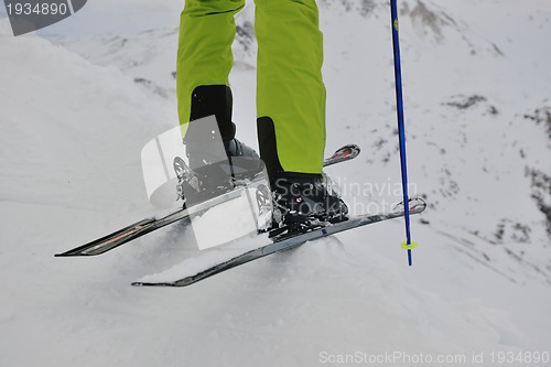 Image of skiing on fresh snow at winter season at beautiful sunny day