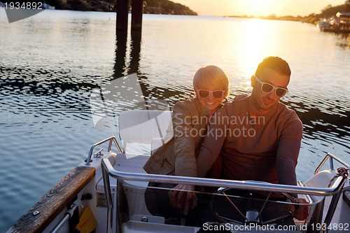 Image of couple in love  have romantic time on boat