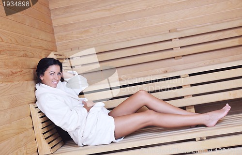 Image of Young woman take a steam bath