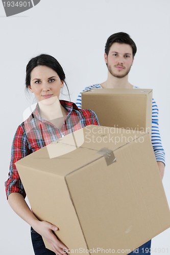 Image of Young couple moving in new house