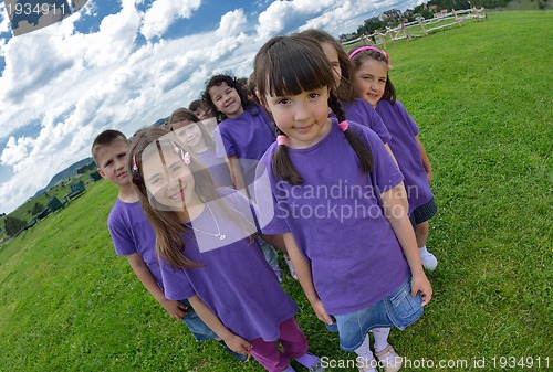Image of happy kids group  have fun in nature