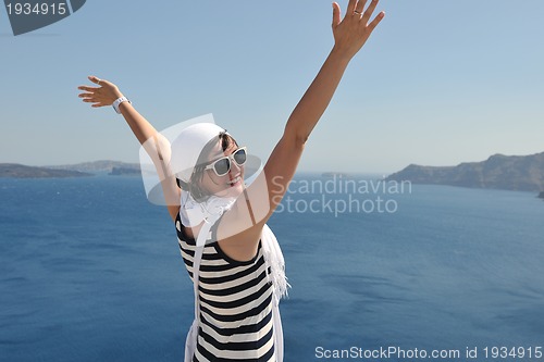 Image of Greek woman on the streets of Oia, Santorini, Greece